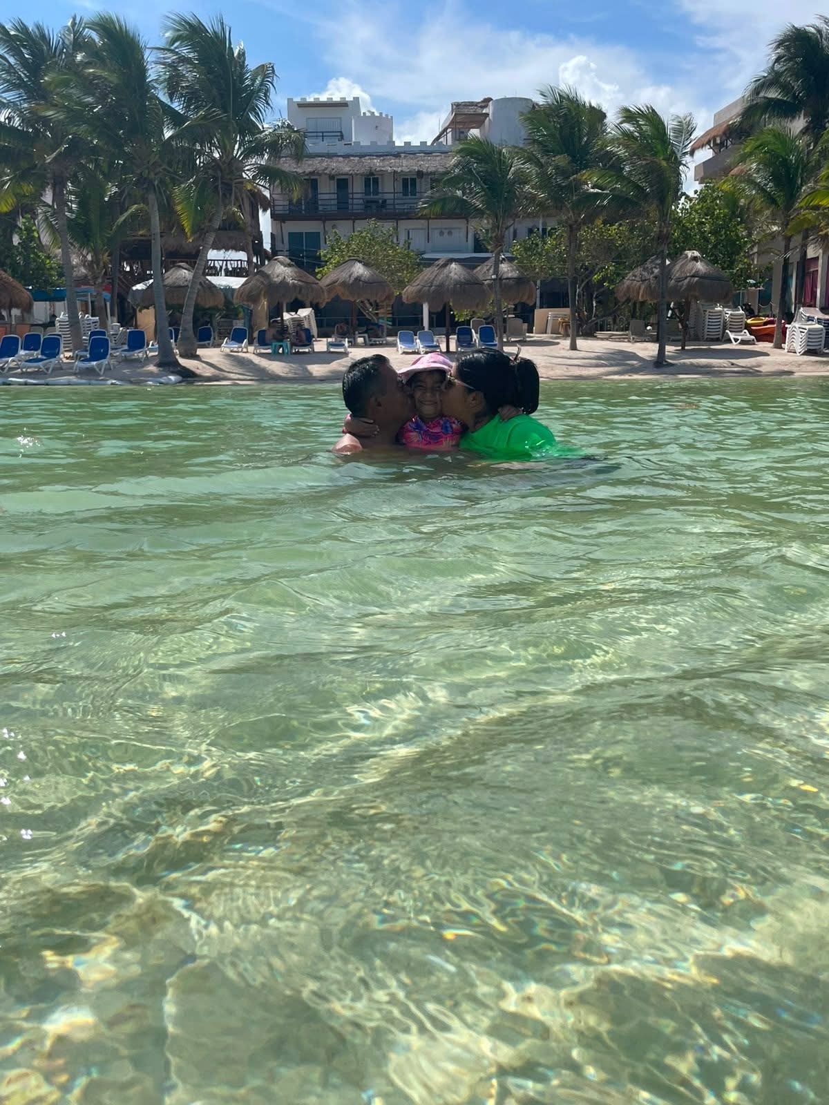 Family enjoying Mahahual waters